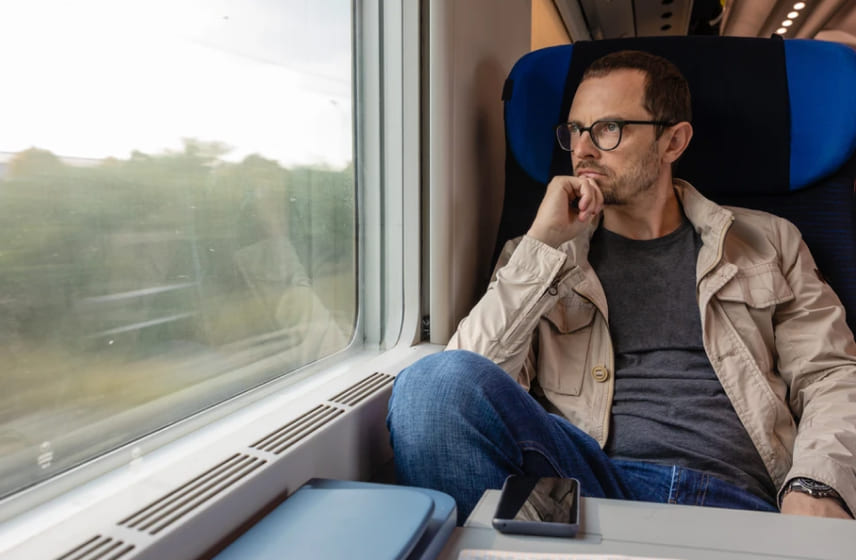 Man on a train thinking about divorce